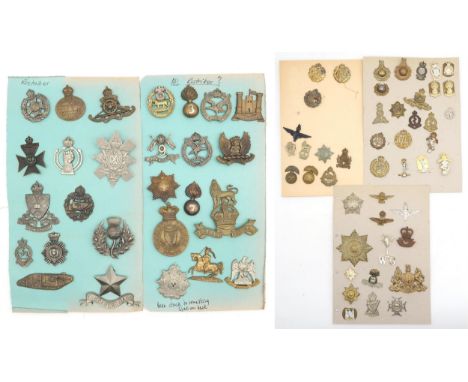 An album of mixed military cap badges, to include the RAF/RFC, Intelligence Corps, East Lancashire Regiment, Royal Engineers,