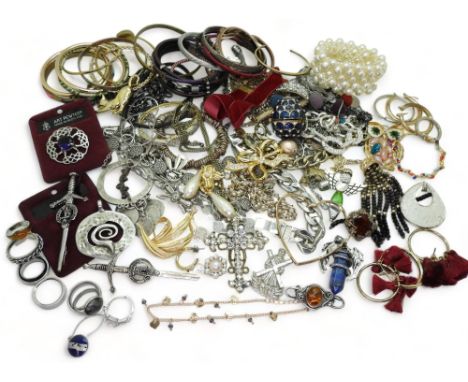 a collection of silver and costume jewellery to include silver bangles, an amber brooch, a silver ribbon chain, and costume j