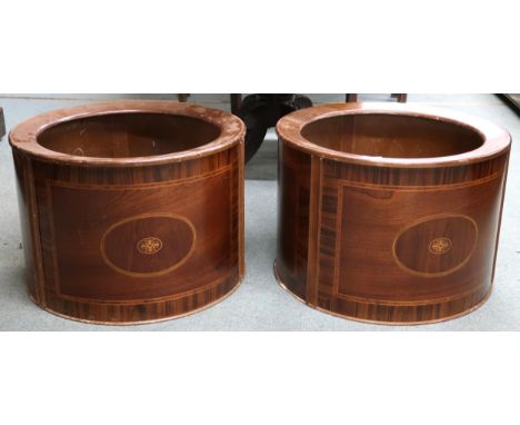 A pair of 20th century Holly Flowers mahogany planter covers, 37cm high x 54cm diameter (2) Condition Report:Available upon r