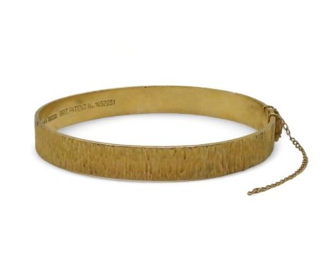 A 9ct gold retro bangle made by Nymph, London hallmarks for 1970, inner diameter 5.7cm, weight 16.3gms Condition Report:Avail