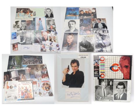 JAMES BOND A collection of signed photographs of James Bond actors and associated figures, to include examples purchased from