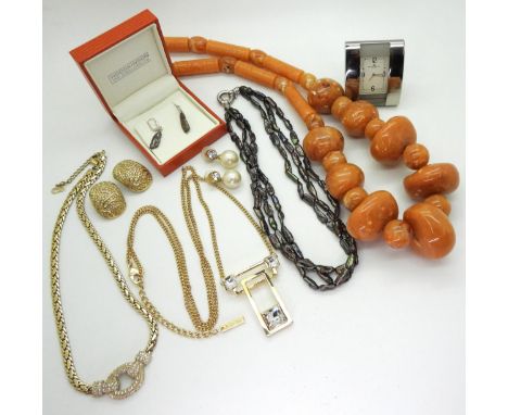 A diamante set Christian Dior necklace and earrings, a necklace by Jaeger, a Baume &amp; Mercier travel clock, a suite of sil