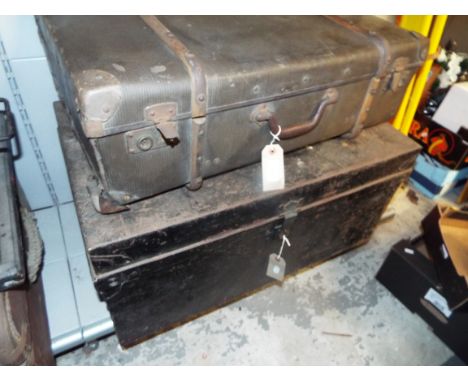 A vintage wooden bound suite case with internal tray and a black painted military style trunk