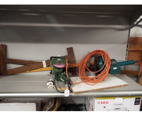 A Black & Decker hedge trimmer together with an electric chainsaw sharpener and two glazier's T-squares and rule