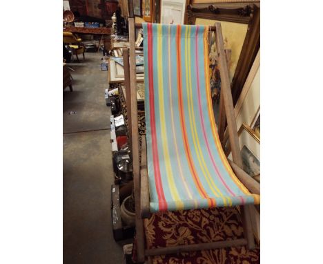 A vintage child's folding wooden deck chair