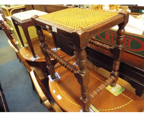 A bobbin turned stool with cane seat