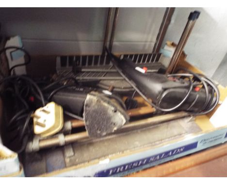 An electric sander and drill, tile cutter and mitre saw