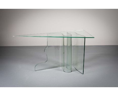 A glass topped side table of triangular shape on a 'S' shaped scrolling support, 119cms  x 59cmsNote: Possibly Alva Gallagher