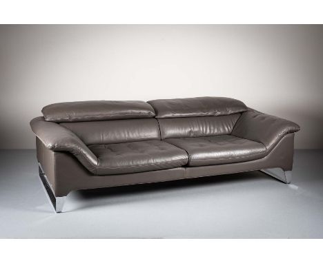 A LEATHER SOFA, by Roche Bobois, with adjustable head rest on chrome legs, (bearing lable), 230cm (w) x 115cm (d) x 62 cm (h)