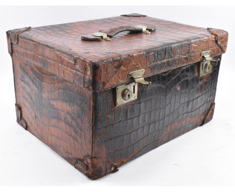 North West Tannery Co. - an early 20th century Edwardian crocodile leather vanity suitcase. The case complete with matched br
