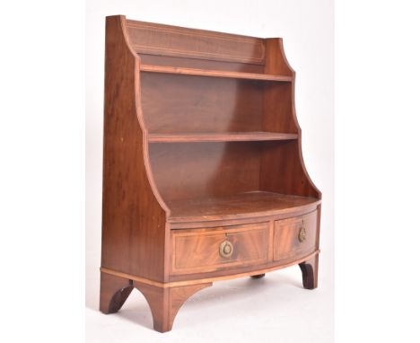 A 19th century mahogany inlaid bow-front waterfall open bookcase. The bookcase having a straight gallery back with inlay pane