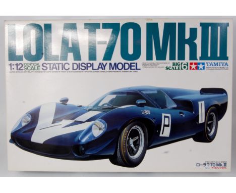 Tamiya 1/12th scale plastic kit for a Lola T-70 Mark 3, appears as issued in the original illustrated all card box, with leaf