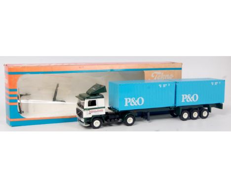 Tekno 1/50th scale diecast model of a Volvo F12 "Overbeek" Rotterdam with twin 20ft container load, both containers light blu