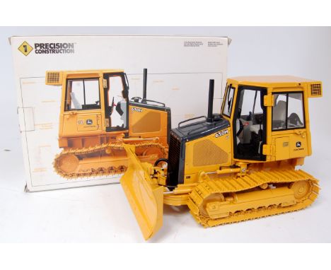 ERTL 1/16th scale diecast model of a John Deere Model 650H dozer, finished in yellow with John Deere Livery, in the original 