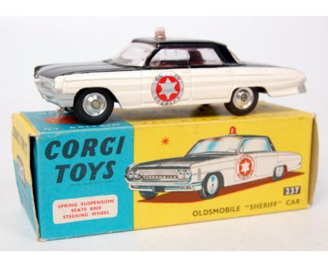 Corgi Toys, 237 Oldsmobile 'Sheriff' car, black body with cream side panels, red interior with roof light, 'County Sheriff', 