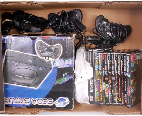 Boxed Sega Saturn Console, with 3 controllers, power leads, and a selection of games, 8 games in total to include Bust-A-Move