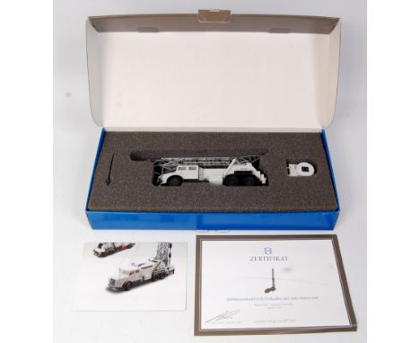 Conrad, No.1042/0 1/50th scale Faun-Hauber Truck, light grey and dark grey body, appears complete in the original foam packed