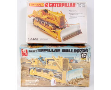 Caterpillar 1/25th scale plastic kit group, 2 examples to include MT Caterpillar D8H Bulldozer, and a Matchbox CAT D8H Bulldo