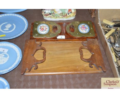 A Victorian burr walnut brass and enamel mounted expanding bookrack; and an olive wood folding bookrack