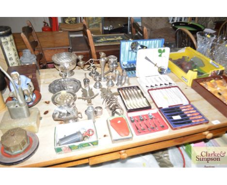 Various platedware to include a pair of candelabra, cruet items, toast rack, cutlery etc.