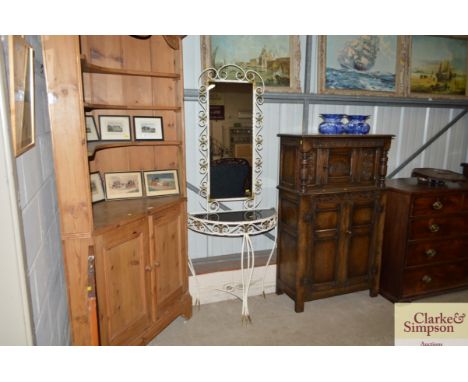 A retro metalware hall table and mirror