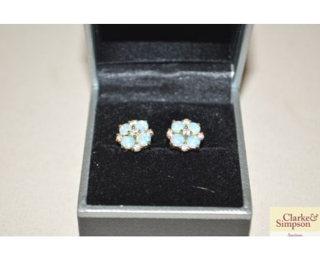 A pair of opal and diamond cluster ear-rings