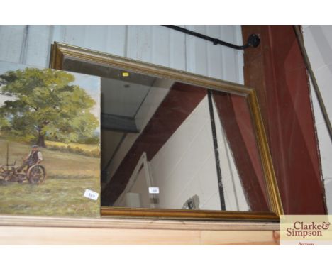 A gilt framed wall mirror 