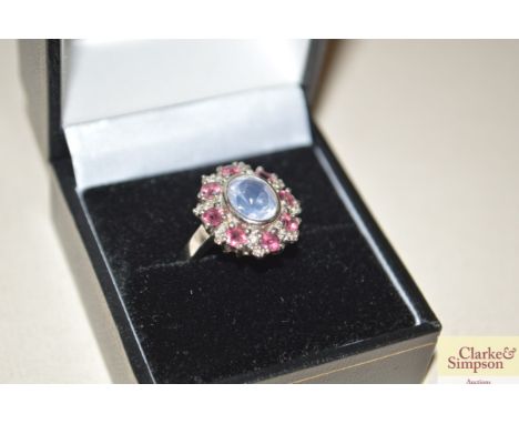 A silver ruby and opaline ring 