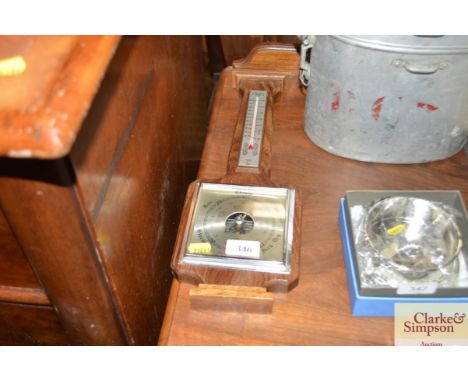 An oak cased barometer
