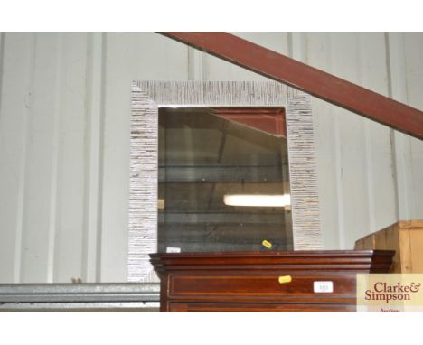 A silvered framed bevel edged wall mirror 