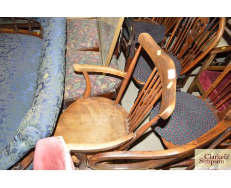 An early 20th Century beech stick back elbow chair 