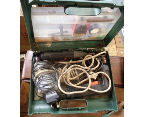A quantity of cased tools including hammer drills, a Trojan rotary hammer, etc.