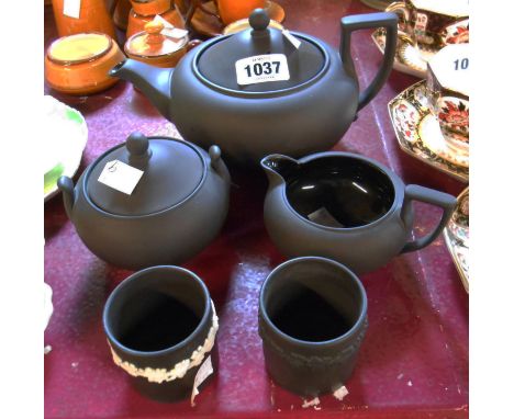 A Wedgwood black basalt tea set comprising teapot, milk jug and sucrier of classical form - sold with two other items