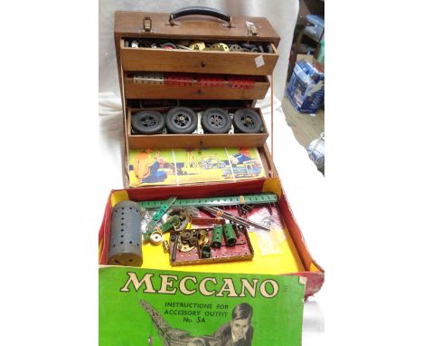 An old wooden tool chest containing a quantity of Meccano and instruction - sold with a box of similar
