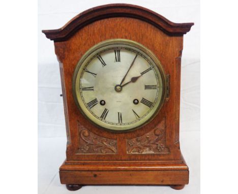 An early 20th Century German mahogany cased mantel clock with silvered dial and eight day gong striking movement