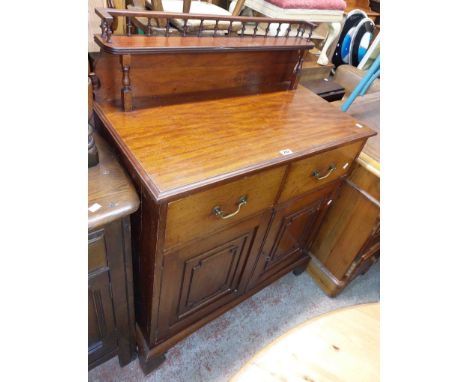 An 87cm antique mahogany chiffonier with shelf to top, two frieze drawers and pair of panelled cupboard doors under, set on b