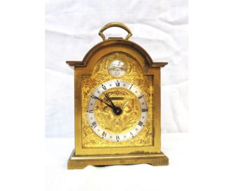 A vintage small Swiza brass cased alarm clock with mechanical movement