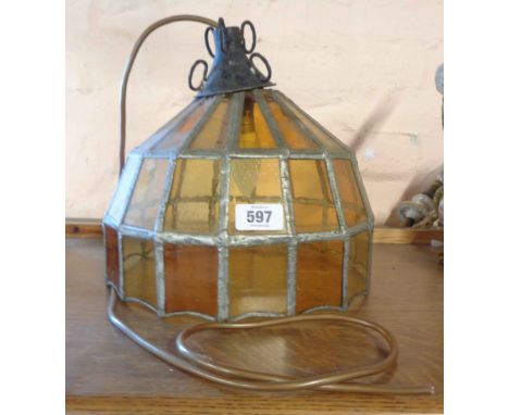 An old hanging lamp with leaded coloured glass shade