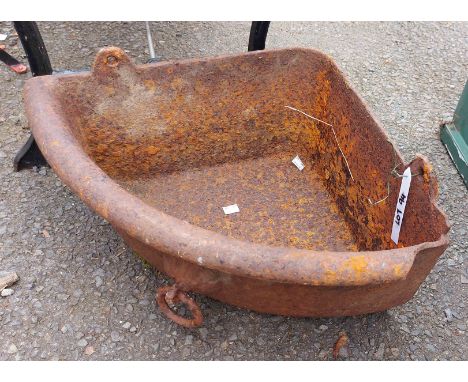A small cast iron corner feed trough