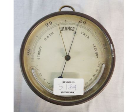 An antique brass cased sedan style wall barometer with printed dial, curved thermometer scale and aneroid works - working