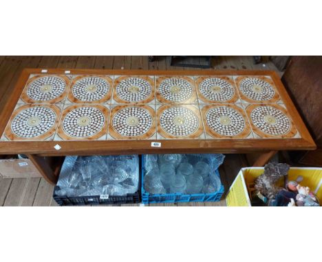 A 1.3m retro teak framed coffee table with tile inset top, set on moulded supports