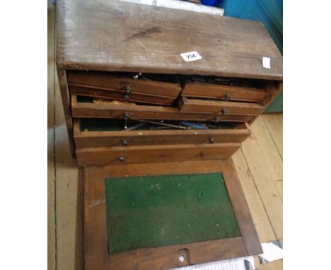 An old wooden Neslein multi-draw tool chest containing a quantity of tools - a/f