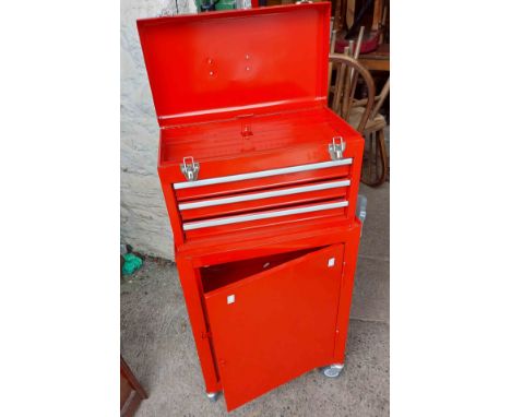A red metal two tier roller tool chest with Halford socket set