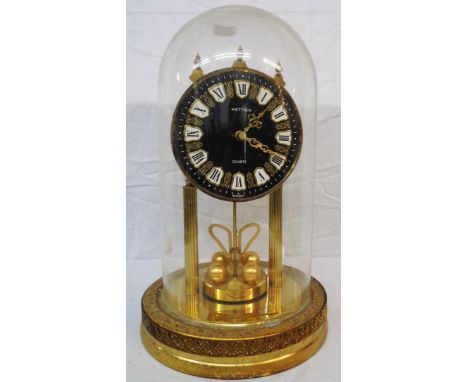 A Hettich anniversary clock with quartz movement under glass dome