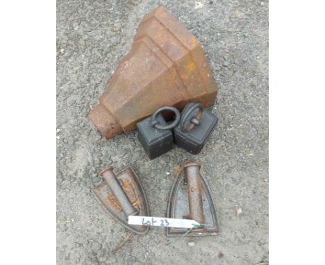 An old cast iron drain hopper, two old weights and two irons