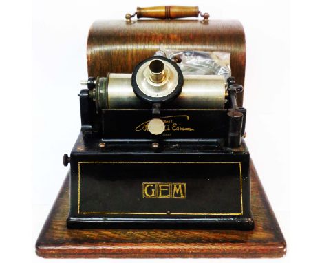 An Edison Gem phonograph in dome-top wooden case with black japanned tin horn - sold with three cylinders