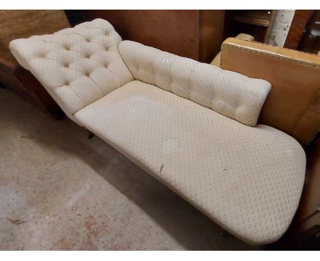 A 1.85m late Victorian chaise longue with button back machine tapestry upholstery, set on turned legs and brown porcelain cas