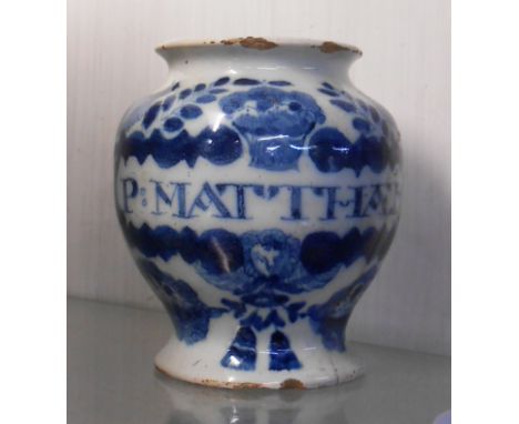 A small 18th Century Delftware drug jar with blue painted decoration around a central cartouche 'Pmatthaei' - a/f
