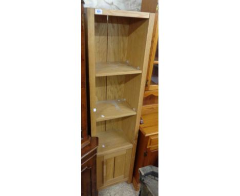 A 43cm modern oak freestanding shelf unit with cupboard under