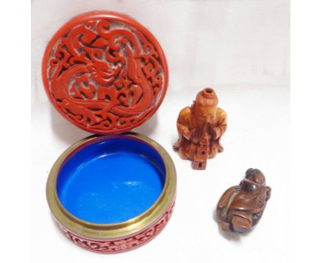 A Chinese cinnabar and blue enamelled circular trinket box - sold with a carved wood figural netsuke and small seated figure 